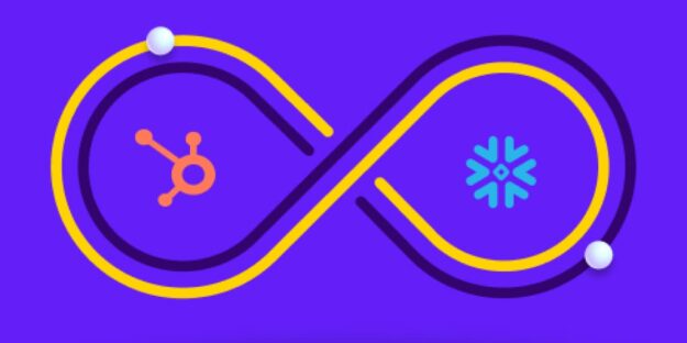 Hubspot and Snowflake symbols inside and infinity loop symbolizing integration